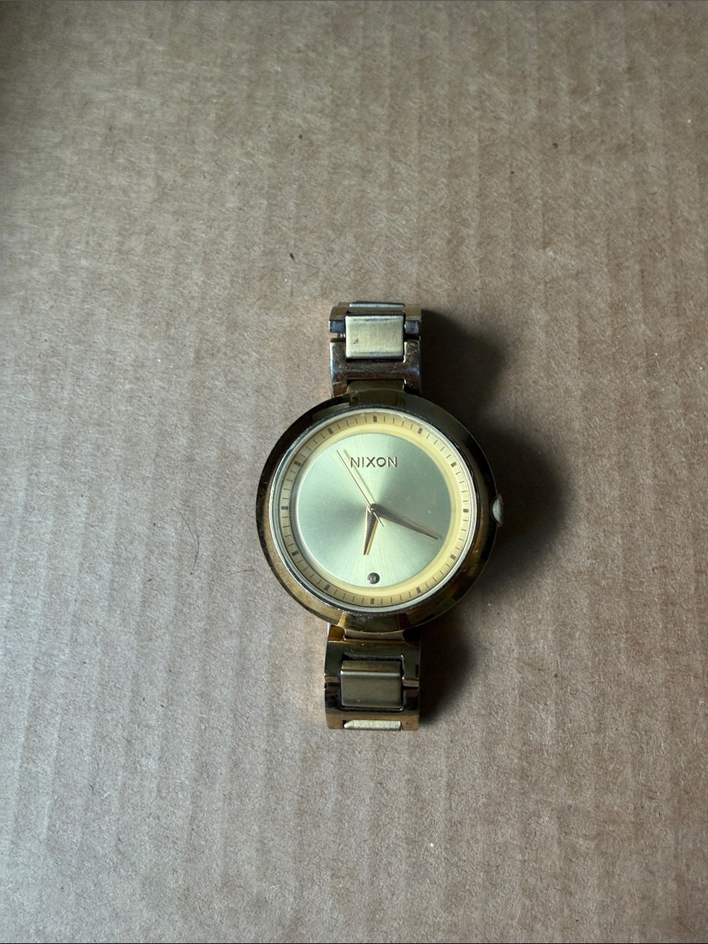 Nixon Gold Stainless Steel Round Dial Watch